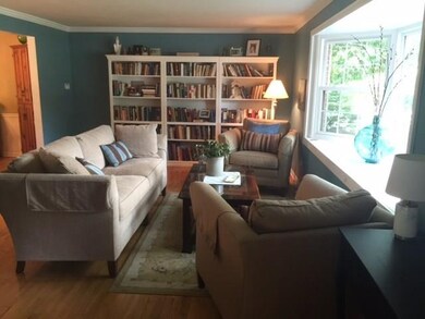 Formal livingroom with large bay window overlookin