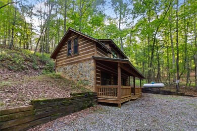 View of property exterior featuring stone siding