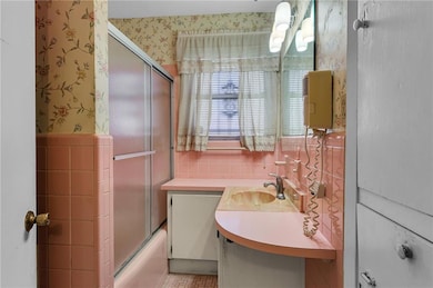 Hall bath has tub/shower combo.