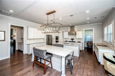 Double Kitchen Islands both wrapped in ship lap