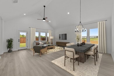 Soaring vaulted ceiling spans the great room & dining area