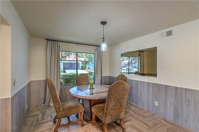 Dining area featuring wainscoting