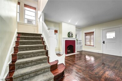 Foyer featuring lots of natural light and the original custom front door.  This home is totally rehabilitated to its original grandure with no work for many years to come.
