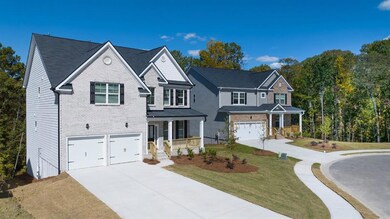 Traditional-style home featuring brick siding, cov