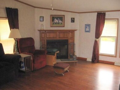 Living room with wood burning fireplace
