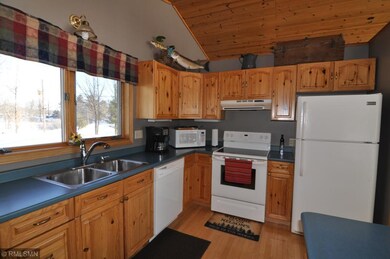 Spacious kitchen with double sink and dishwasher.