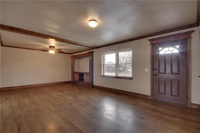 Lots of woodwork in this spacious living room