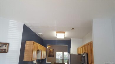 Drywall repair needed on kitchen ceiling - no long
