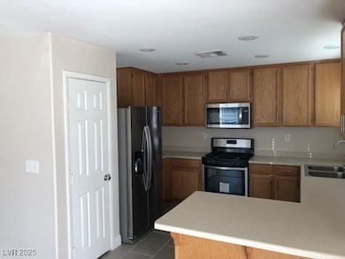 Kitchen featuring stainless steel appliances, ligh