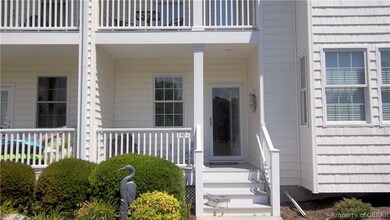 View of exterior entry with a balcony
