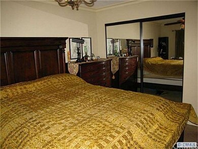 master bedroom with crown moldings