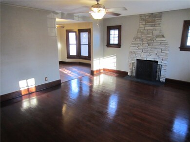 Living room, refinished hardwood floors with a woo