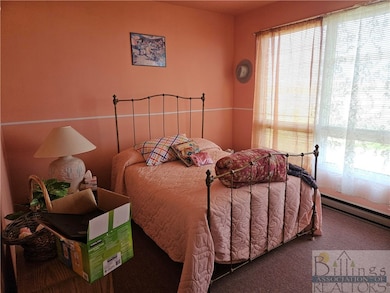 One of ten bedrooms with rustic flair
