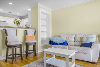 Living area featuring light wood-style flooring, c