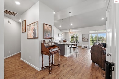 Coat closet and office just off entry opening to large open concept living