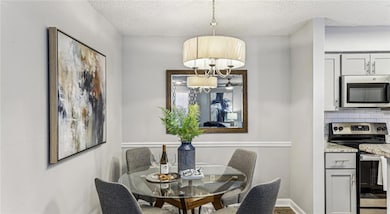 Dining room featuring a textured ceiling and a not