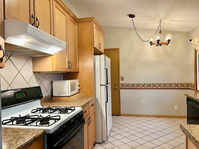 Kitchen with access to the attached 2 car garage