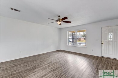 LIVING ROOM WITH NEW LVP FLOORING