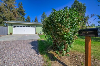 View of front of property featuring driveway and a garage
