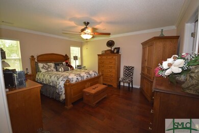 Spacious master bedroom with trim molding.