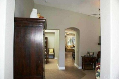 View from Entry; Living Room to the right, Kitchen