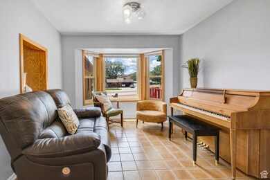 Den with tile flooring