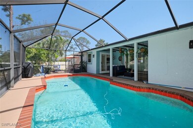View of swimming pool with a fenced in pool, glass