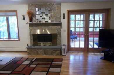 Large family room, fireplace with wood insert, doo