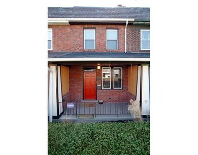 Exterior Front. #13 Dawson is a courtyard rowhouse