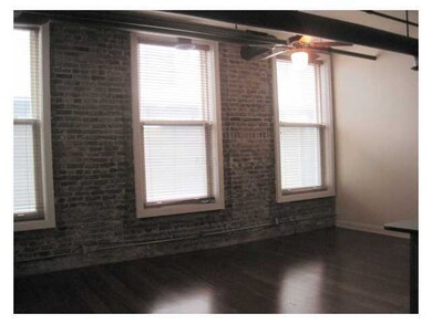 This great living room features exposed brick and 