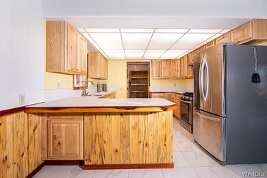Breakfast bar area facing laundry and large pantry