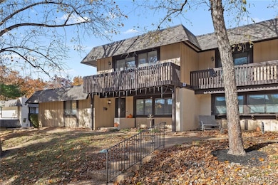 Street view of property with a balcony.