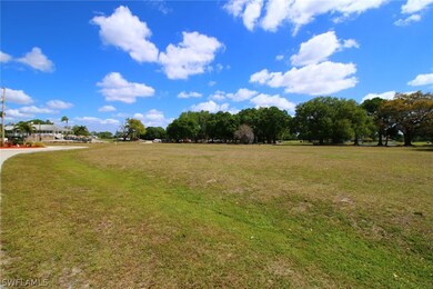 View from the front SW corner of the lot looking north and east, with clubhouse in the distance on the left.