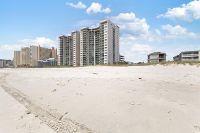 View of property featuring a view of the beach