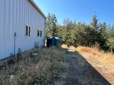 side of shop with water tank 2