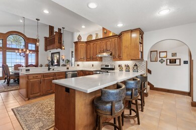 Great kitchen also enjoys great Lake views! Stairc