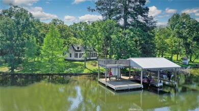 View of dock featuring boat lift and a water view