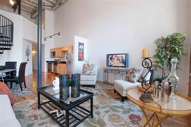 Alternate angle of the living room shows the open floor plan and stylish, renovated kitchen.