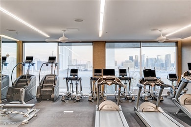 Workout area with a wall of windows, healthy amoun
