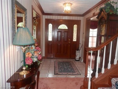 Large entry foyer showcasing the lovely hardwood t