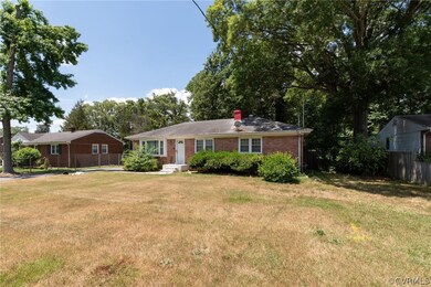 Single story home with a front yard