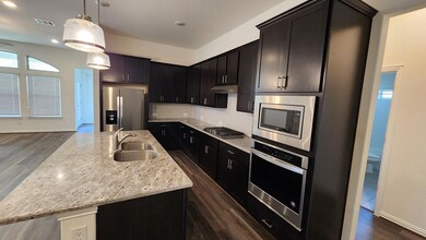 Kitchen featuring stainless steel appliances, a s