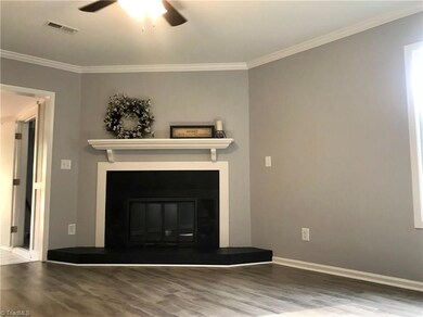 Warm and welcoming modern fireplace is the focal point of the living room