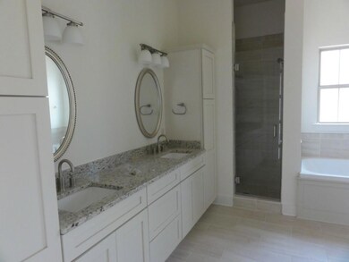 Double vanity with granite; walk-in shower