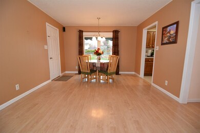 Dining area overlooks the large backyard.