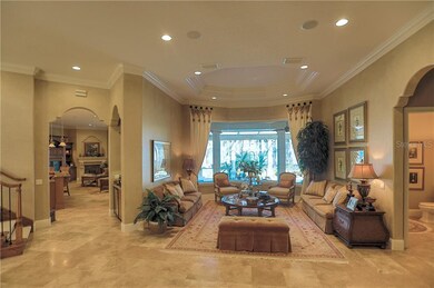 Formal living room overlooking lanai and Lake Butl