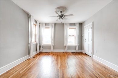 Spare room with a ceiling fan, light wood-style fl
