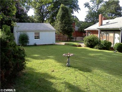 Exterior Back - Large private back yard.  Detached garage w/ workbench. Well landscaped.