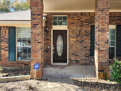 Doorway to property with brick siding
