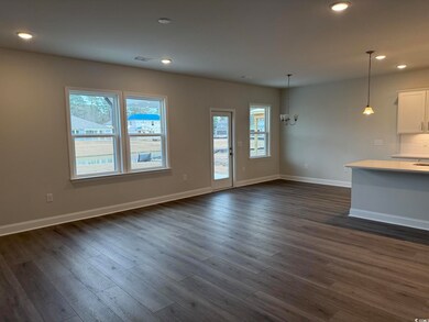Unfurnished living room with dark hardwood / wood-